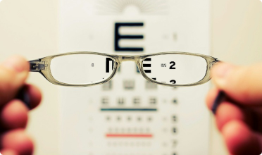 Photo of an optometry chart with glasses