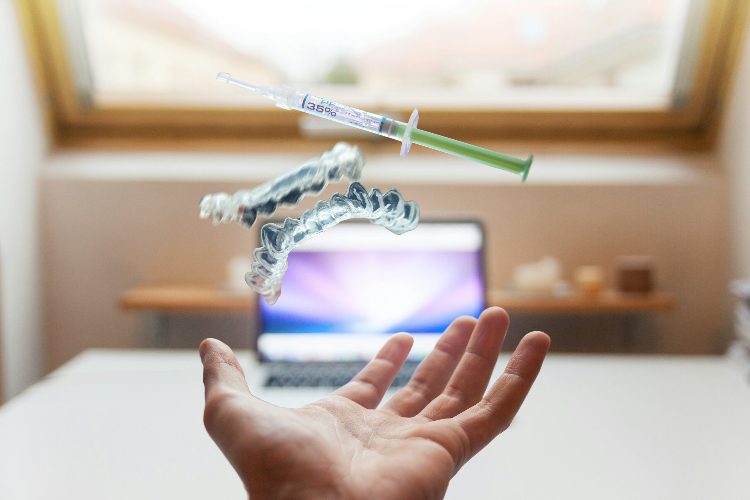 photo of teeth cleaning kit thrown in air.